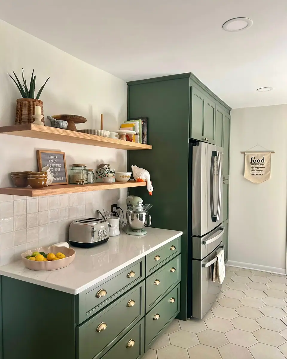 Kitchen with wood floating shelves, brass cabinet pulls and hex floor tile, a Dream Big Contracting project